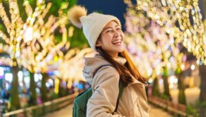冬のイルミネーションを楽しむ女性