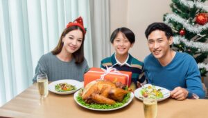 笑顔の家族がクリスマスの食卓でプレゼント交換
