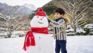 雪だるまと遊ぶ少年