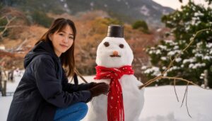雪だるまとポーズを取る若い女性
