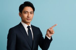 スーツ姿の男性が指差すジェスチャー