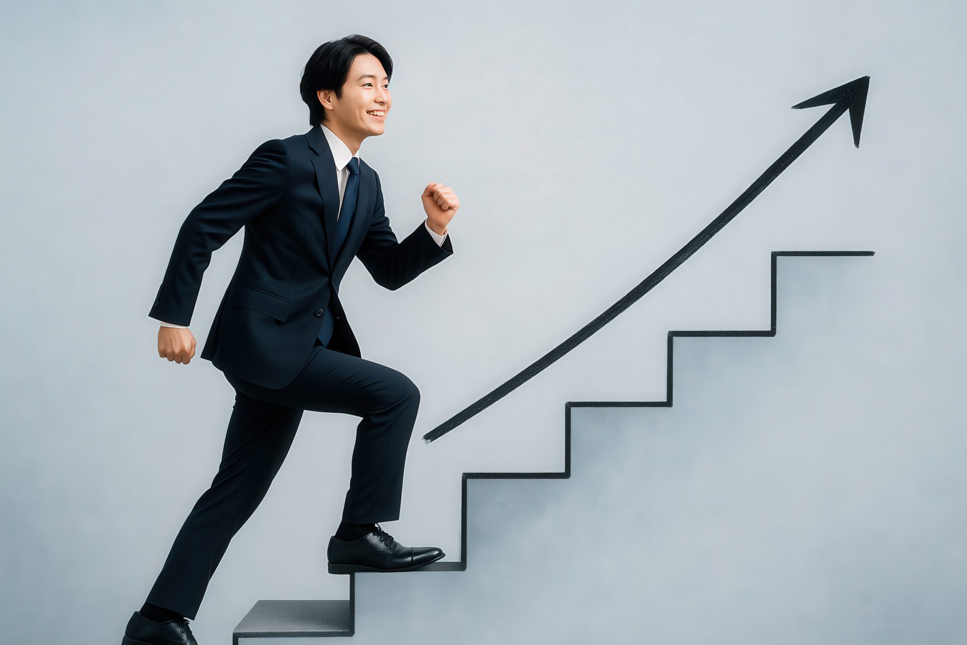成長を目指して階段を上るスーツ姿のビジネスマン