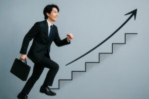 ビジネスバッグを持ちステップアップするスーツ姿のビジネスマン