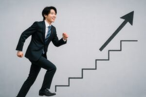 目標に向かって階段を上るスーツ姿の若いビジネスマン