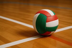 体育館の白線上に転がる赤緑白のバレーボール