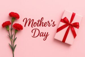 赤いリボンのギフトと母の日メッセージとカーネーション