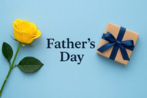 英語のFather’s Day文字と黄色いバラとクラフト包装ギフト