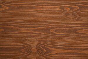 木目が際立つ濃い色の板の背景素材