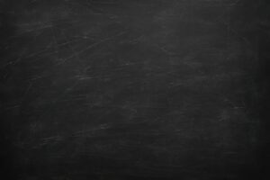 傷が多く刻まれた黒板のテクスチャ