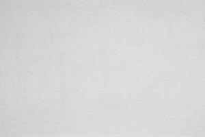 細かい傷の入った白い板のテクスチャ