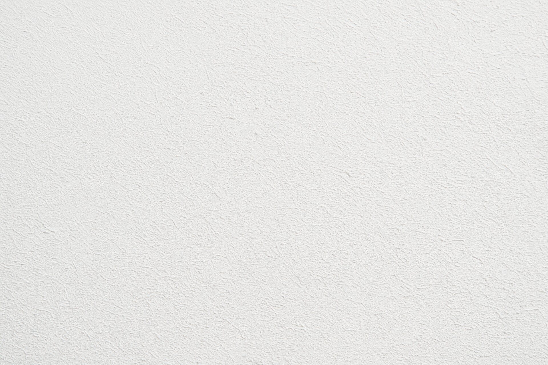 明るい白壁の繊細な表面テクスチャ