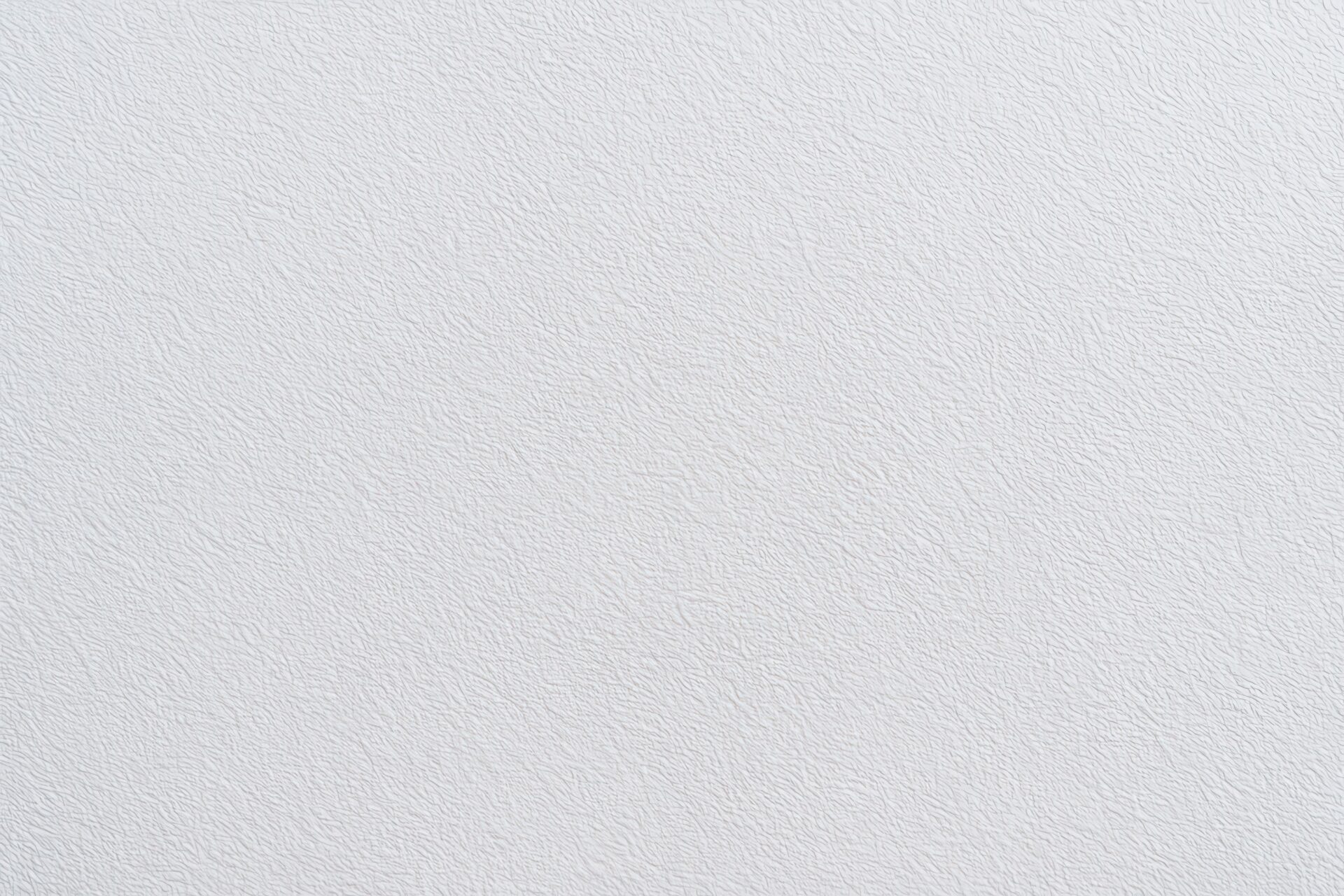 フラットな白い壁の細かな凹凸模様