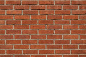 赤茶色の煉瓦が整然と積まれた壁のテクスチャ