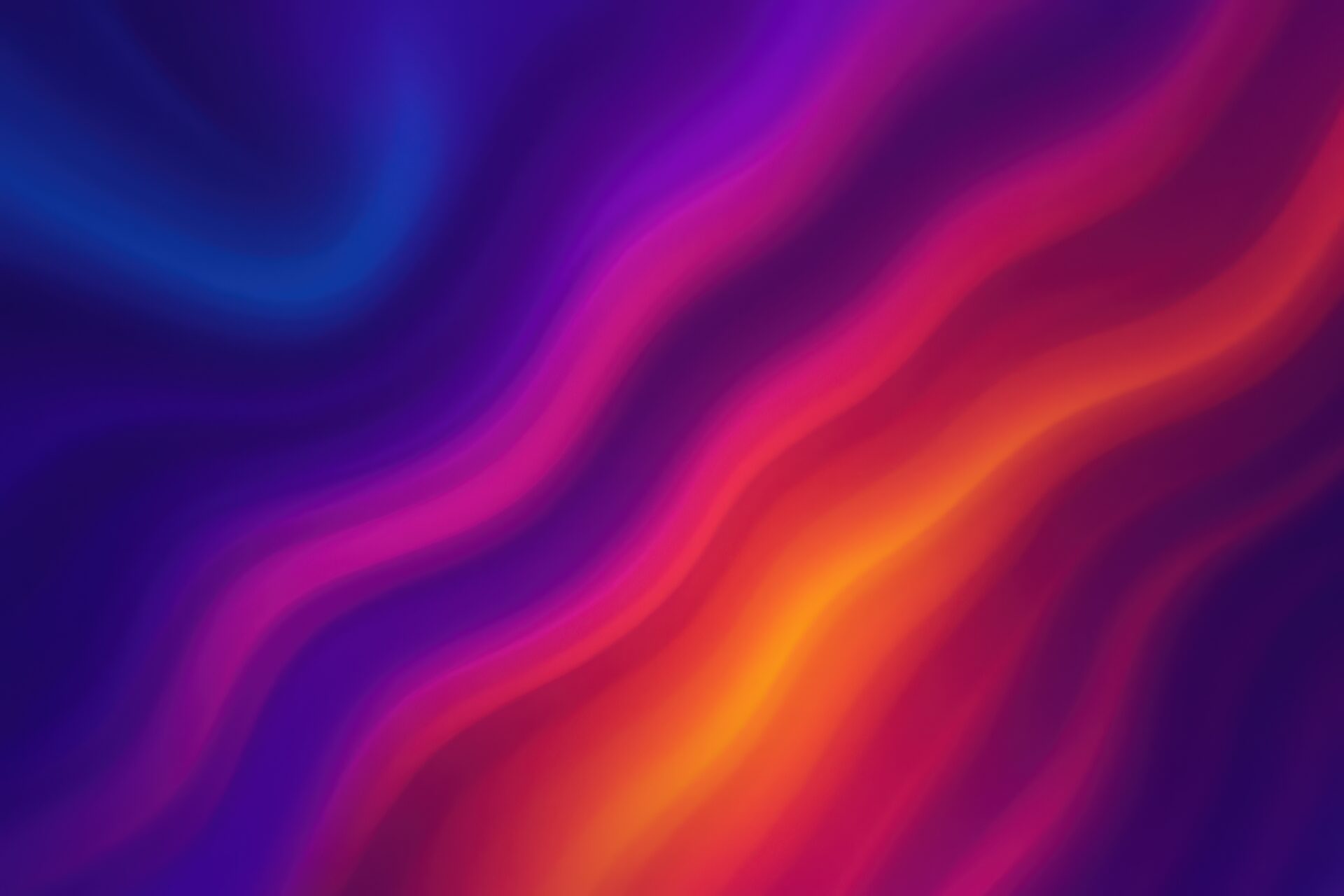 青から赤へのグラデーションが流れる抽象アート背景