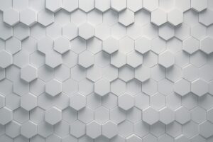 白の立体的な六角形が並ぶ幾何学的テクスチャ背景