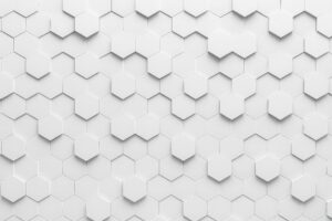 白い六角形が整然と並ぶ立体的なモノクロ背景