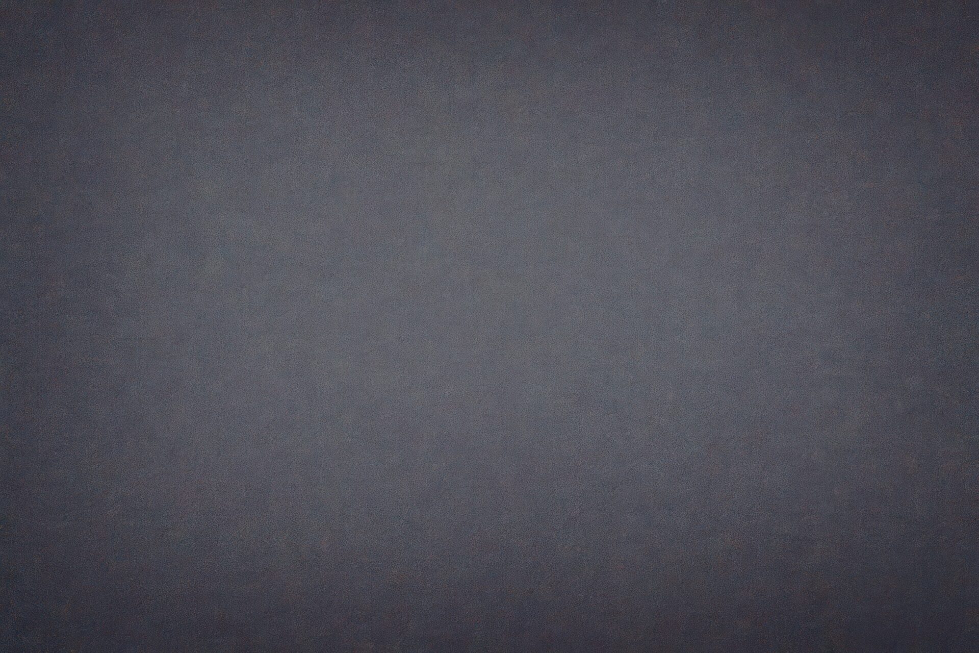 ノイズ風のピクセルが広がる暗いデジタル背景