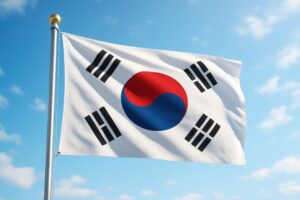 青空にたなびく韓国国旗のポール付き屋外風景