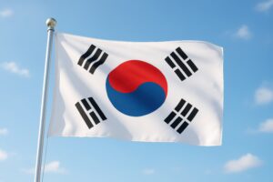 風に揺れる韓国国旗と青空の開放的な構図
