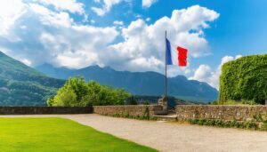 フランス国旗と山々を背景にした庭園