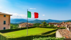 緑豊かな庭と共に掲げられたイタリア国旗