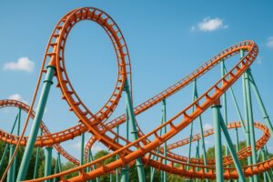 ループするオレンジ色のジェットコースターのレール