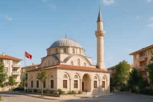 トルコ国旗が掲げられた街中のモスクと青空