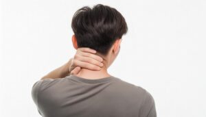 首を押さえる若い男性後ろ姿2