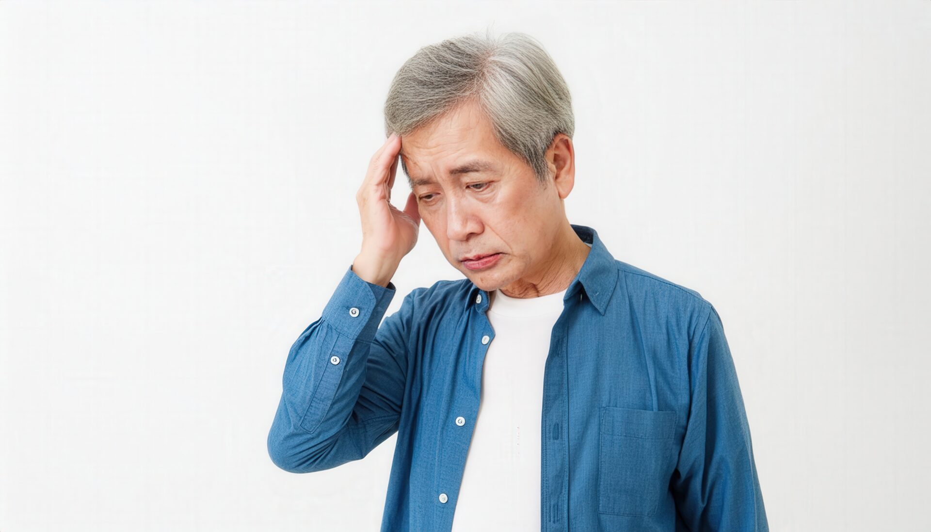 頭痛に悩む中年男性