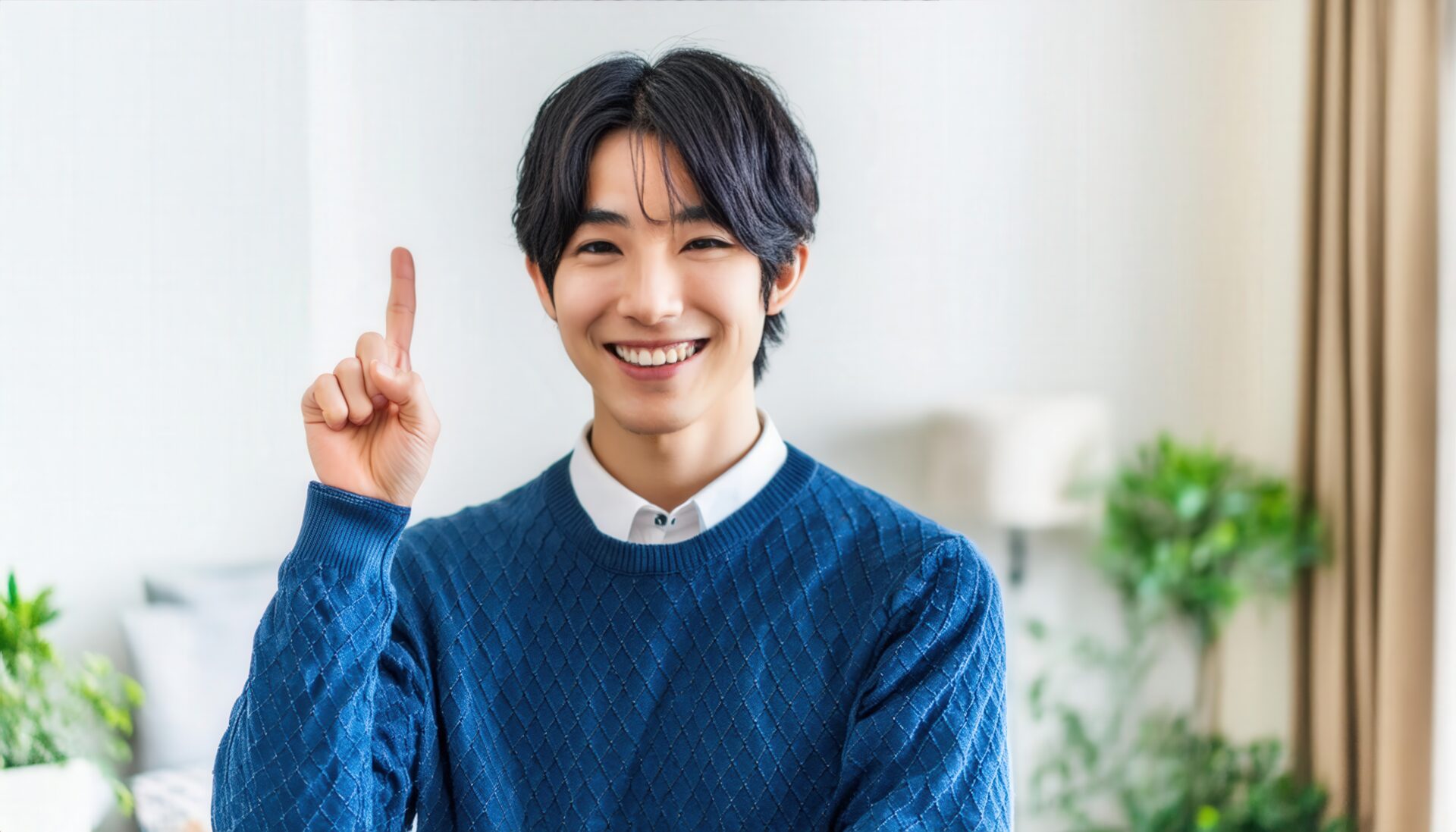 セーターを着た若い人が指をさす