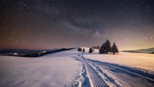 星空の雪道と冬の丘