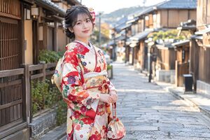 古い町並みの石畳を歩く振袖姿の20代女性