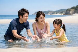 海で水遊びをする家族