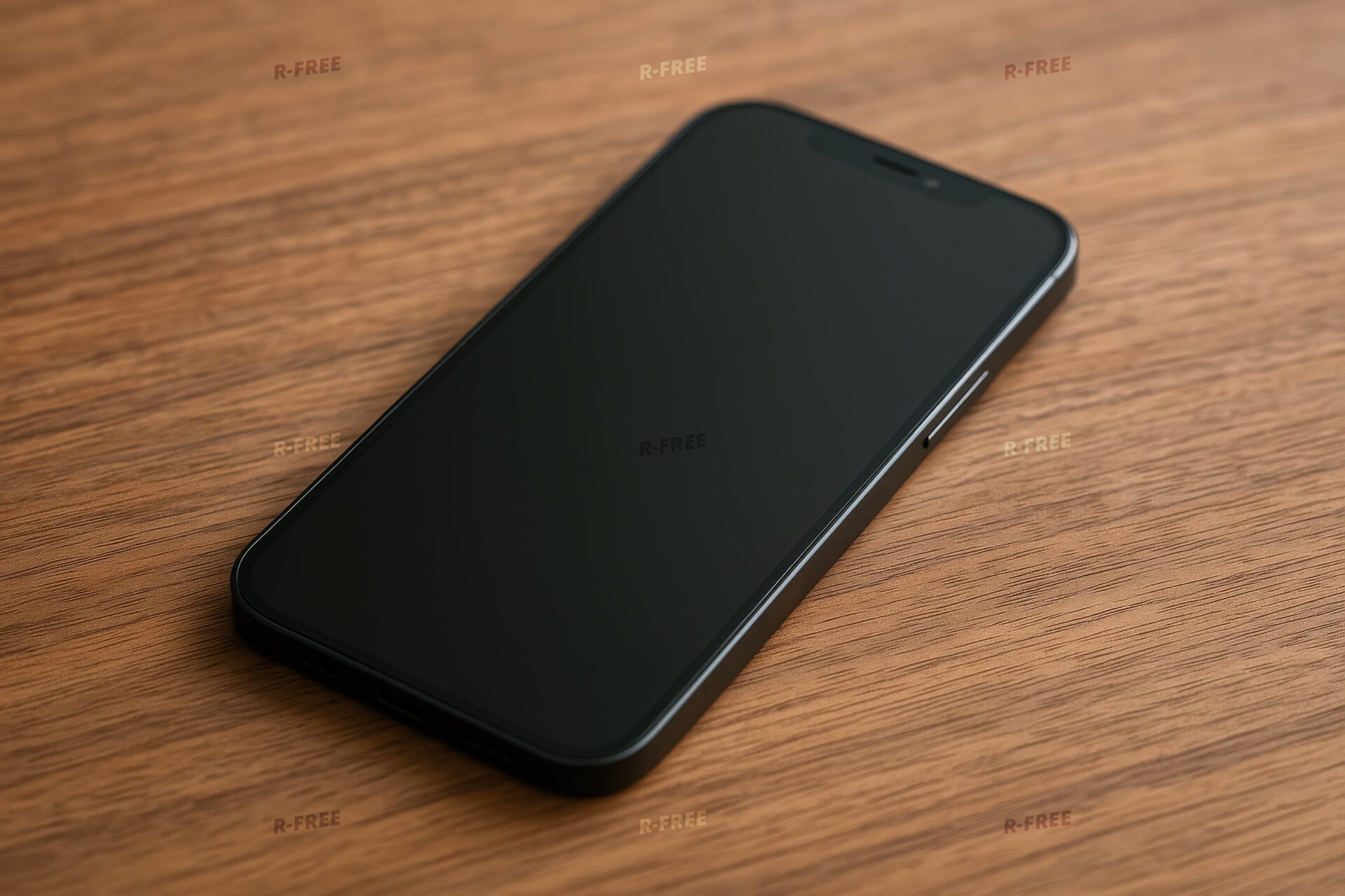 木目の上に置かれたスマートフォン（黒画面）