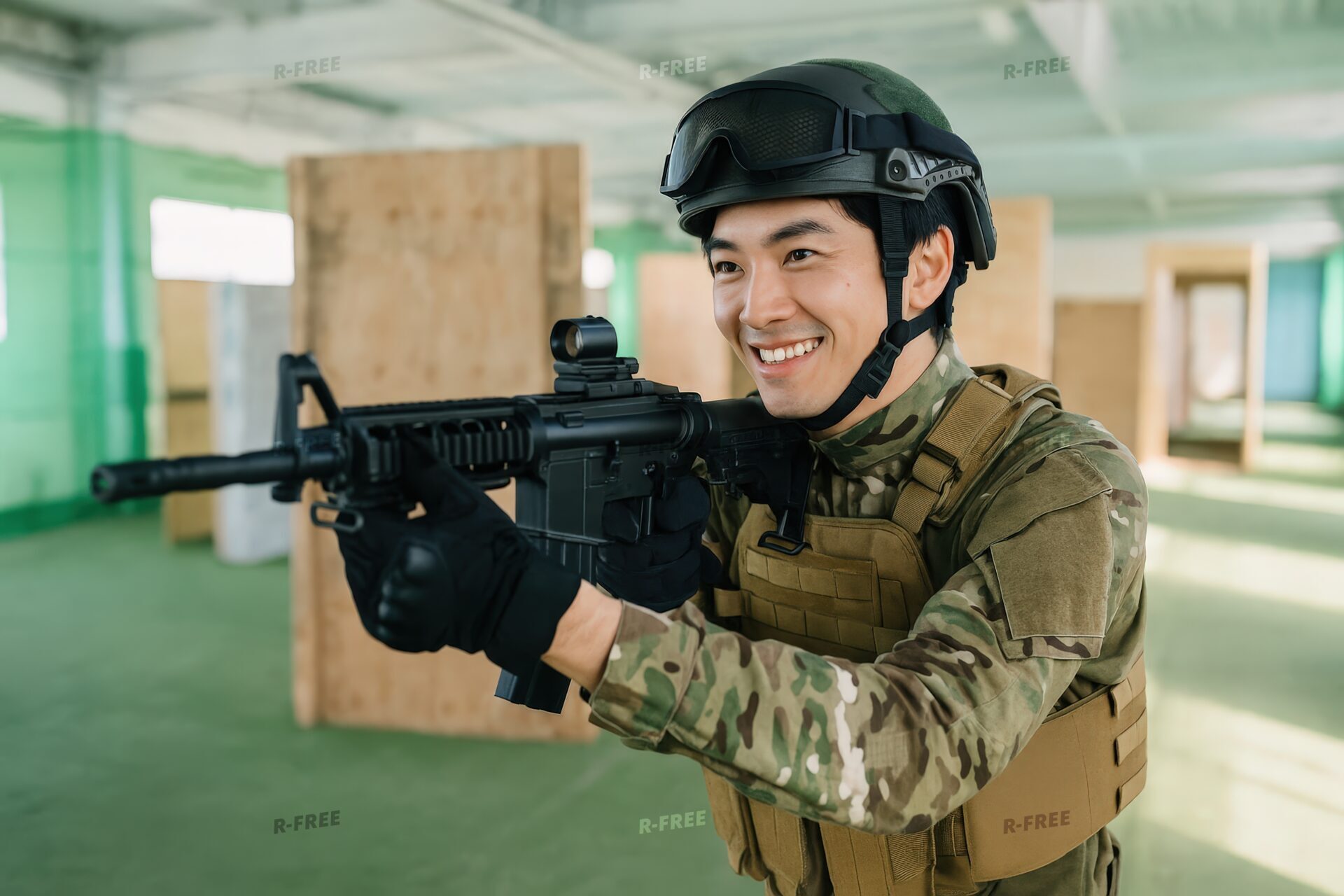 屋内サバゲーフィールドで銃を構える若い男性